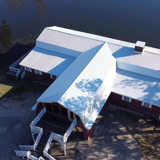 Front-side view of a large white roof installation.